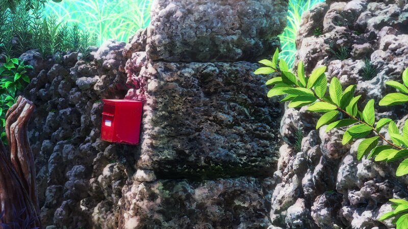 Red Mailbox on Rock