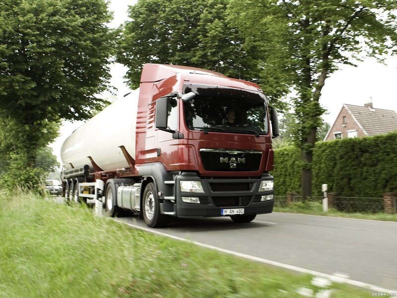 Red MAN truck on a road