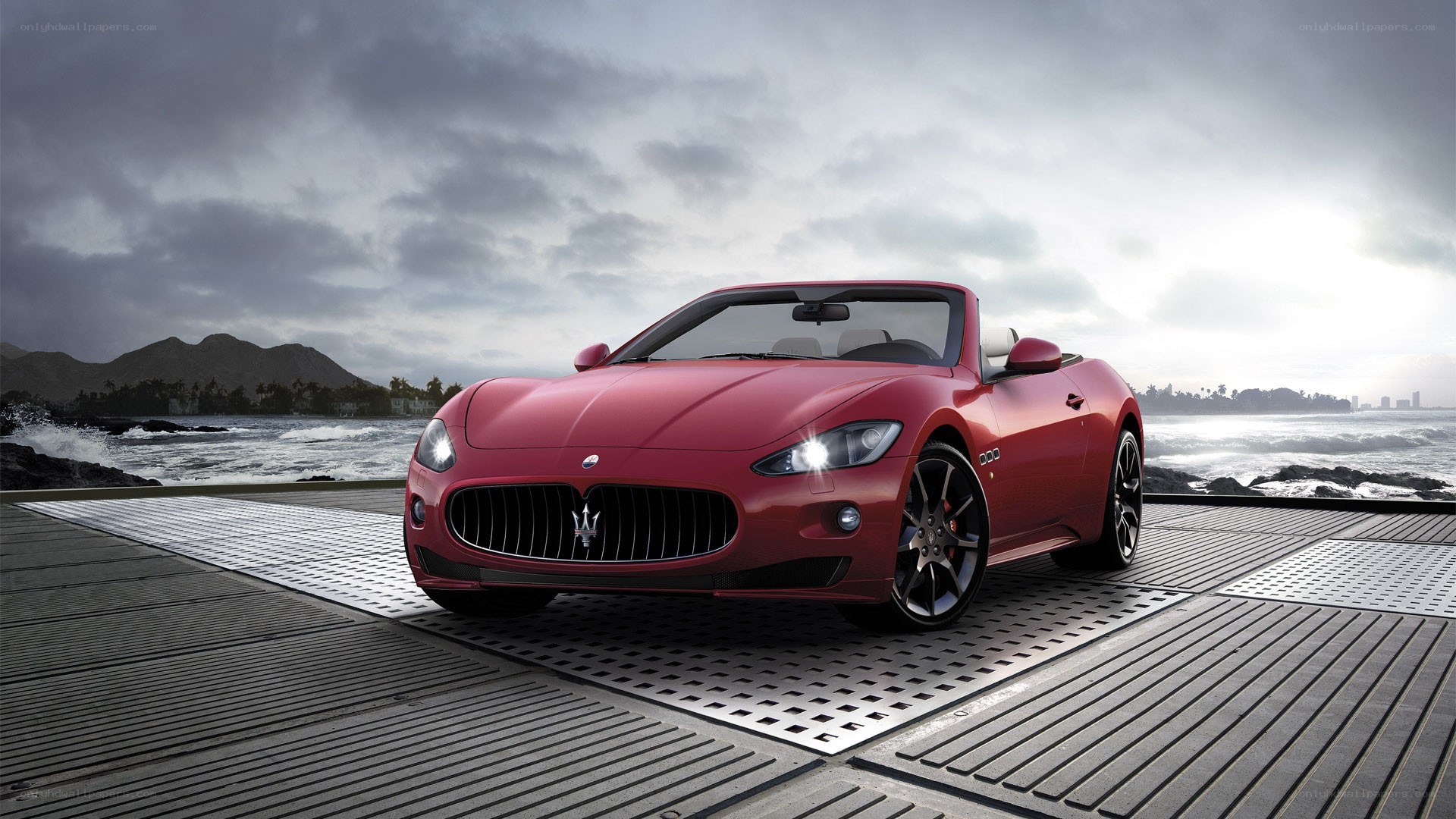 Red Maserati convertible on dock