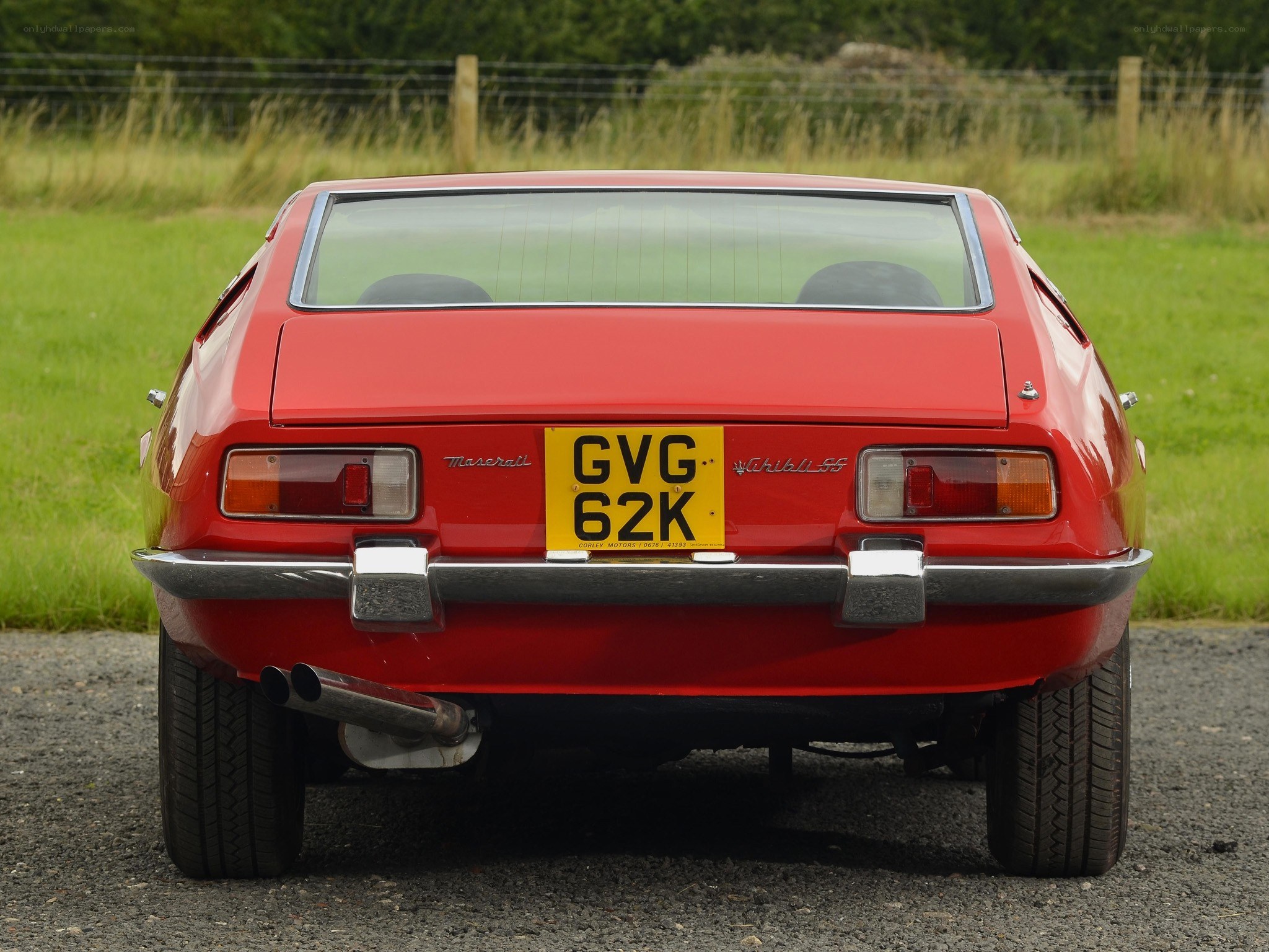 red maserati ghia rear view