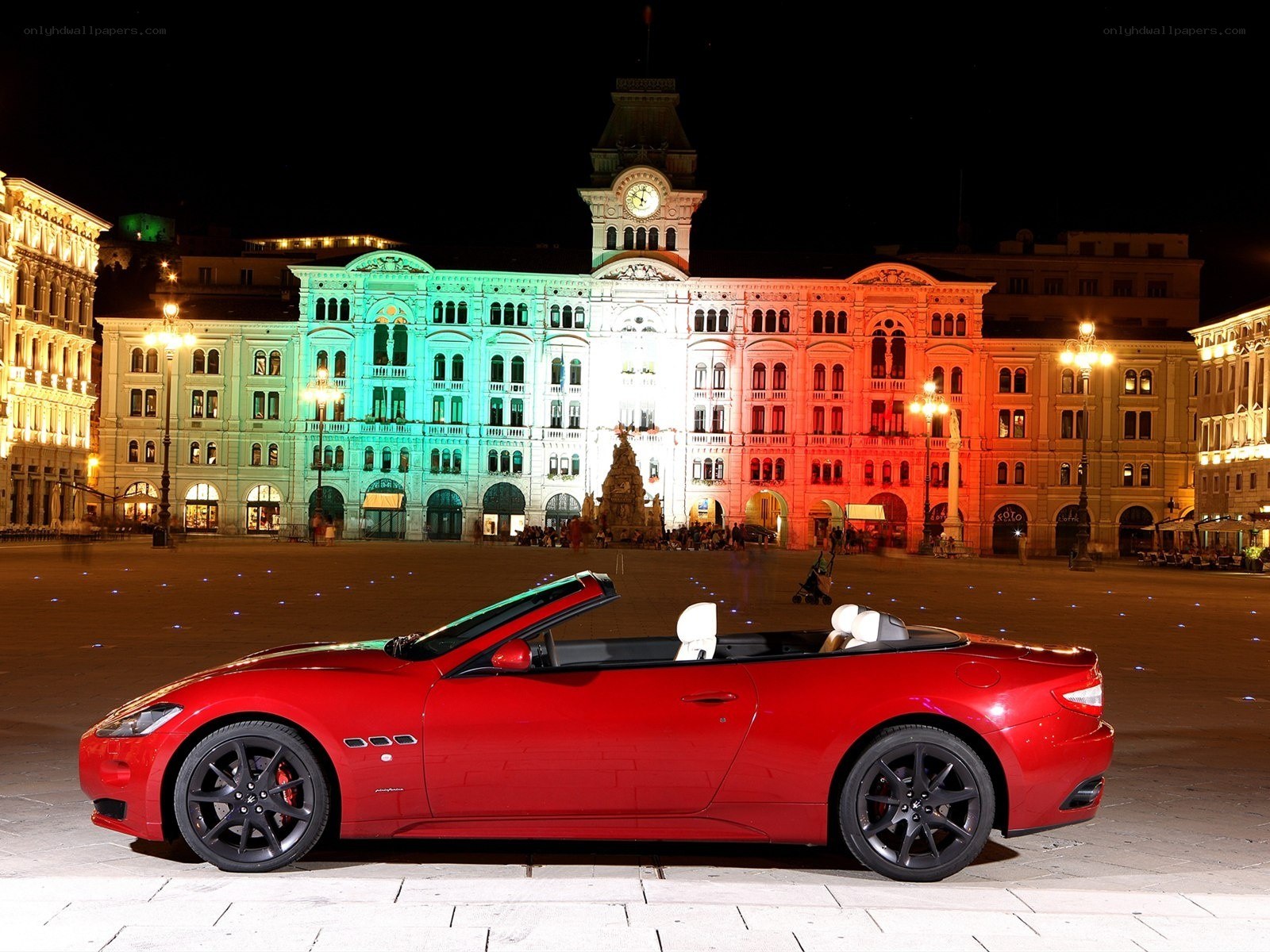 Red Maserati in city square