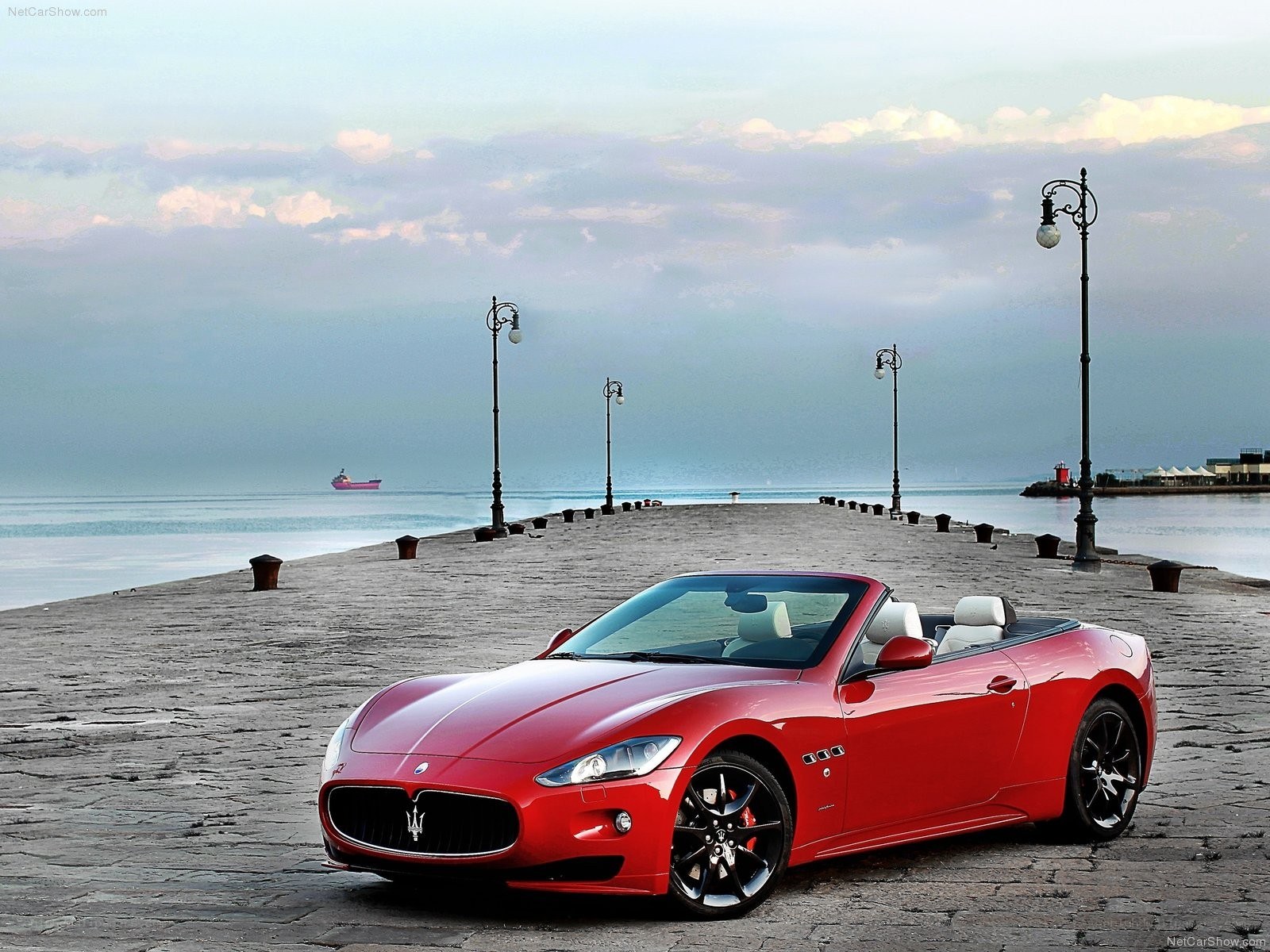 Red Maserati on a pier
