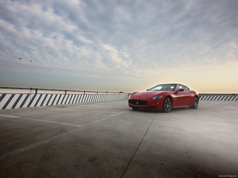 Red Maserati on a rooftop