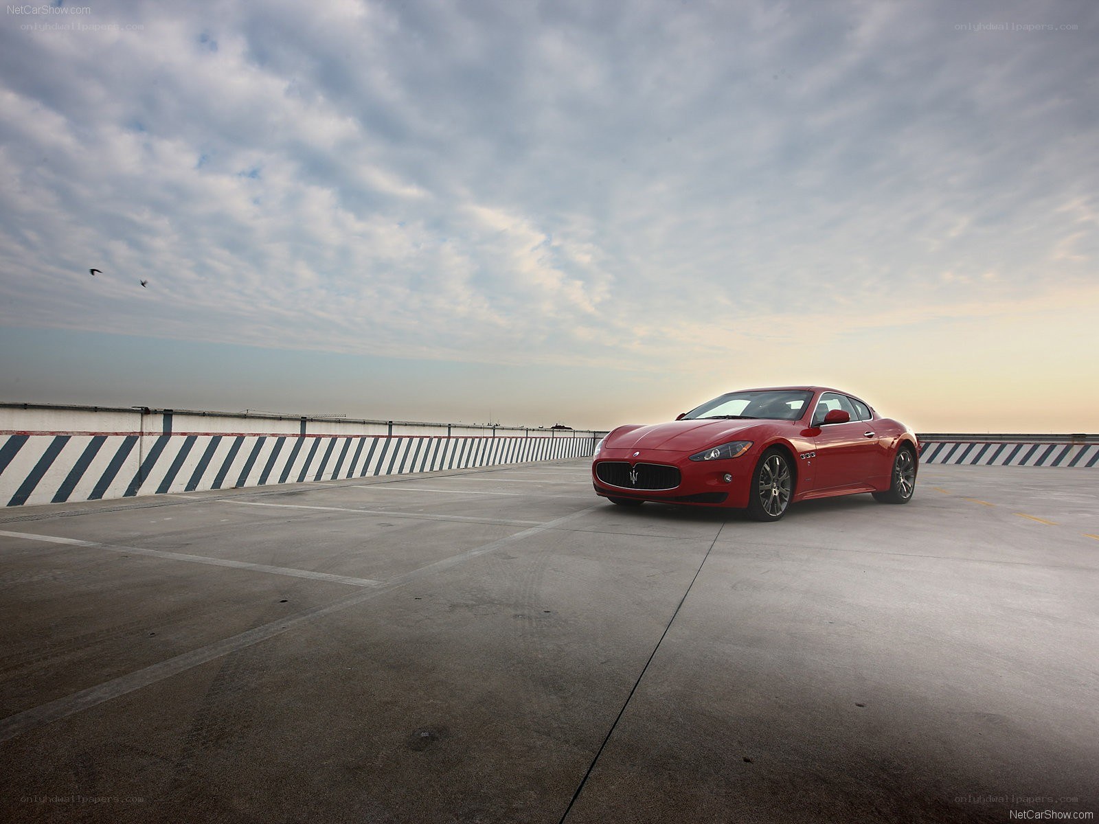 Red Maserati on a rooftop