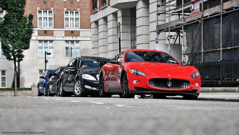 Red Maserati on city street