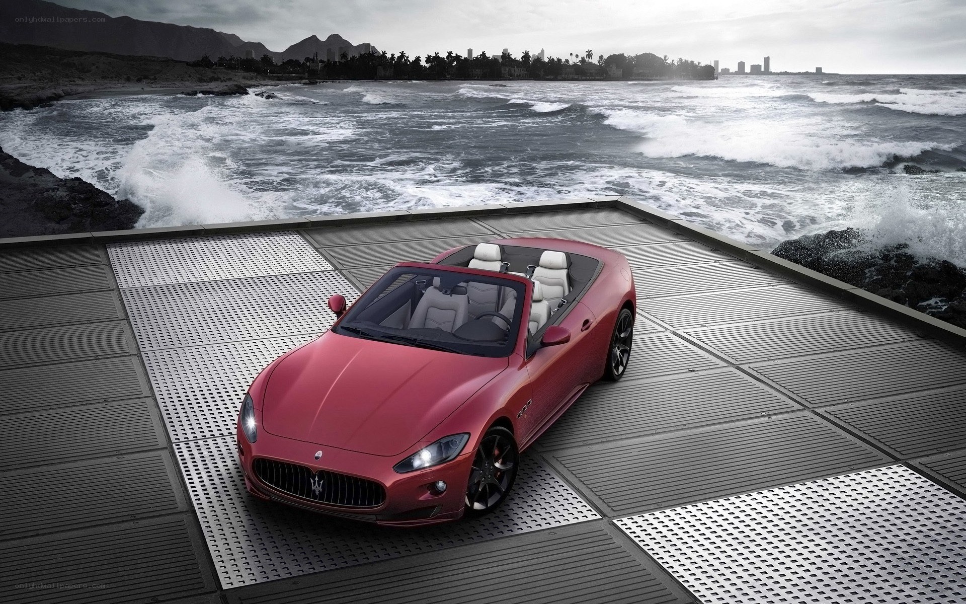 Red Maserati on coastal platform