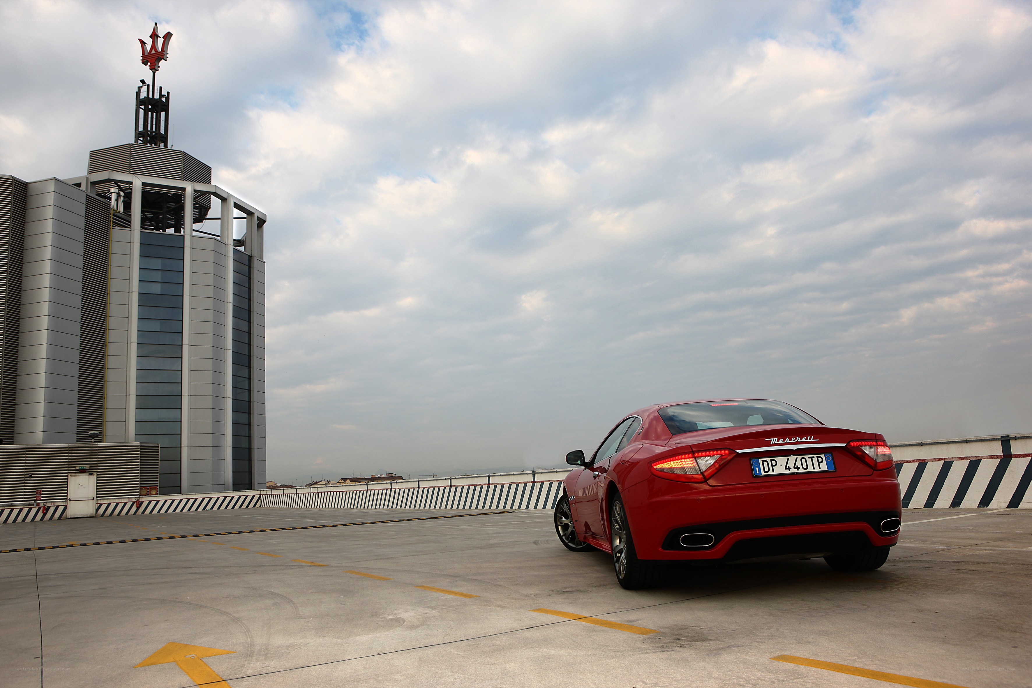 Red Maserati on rooftop