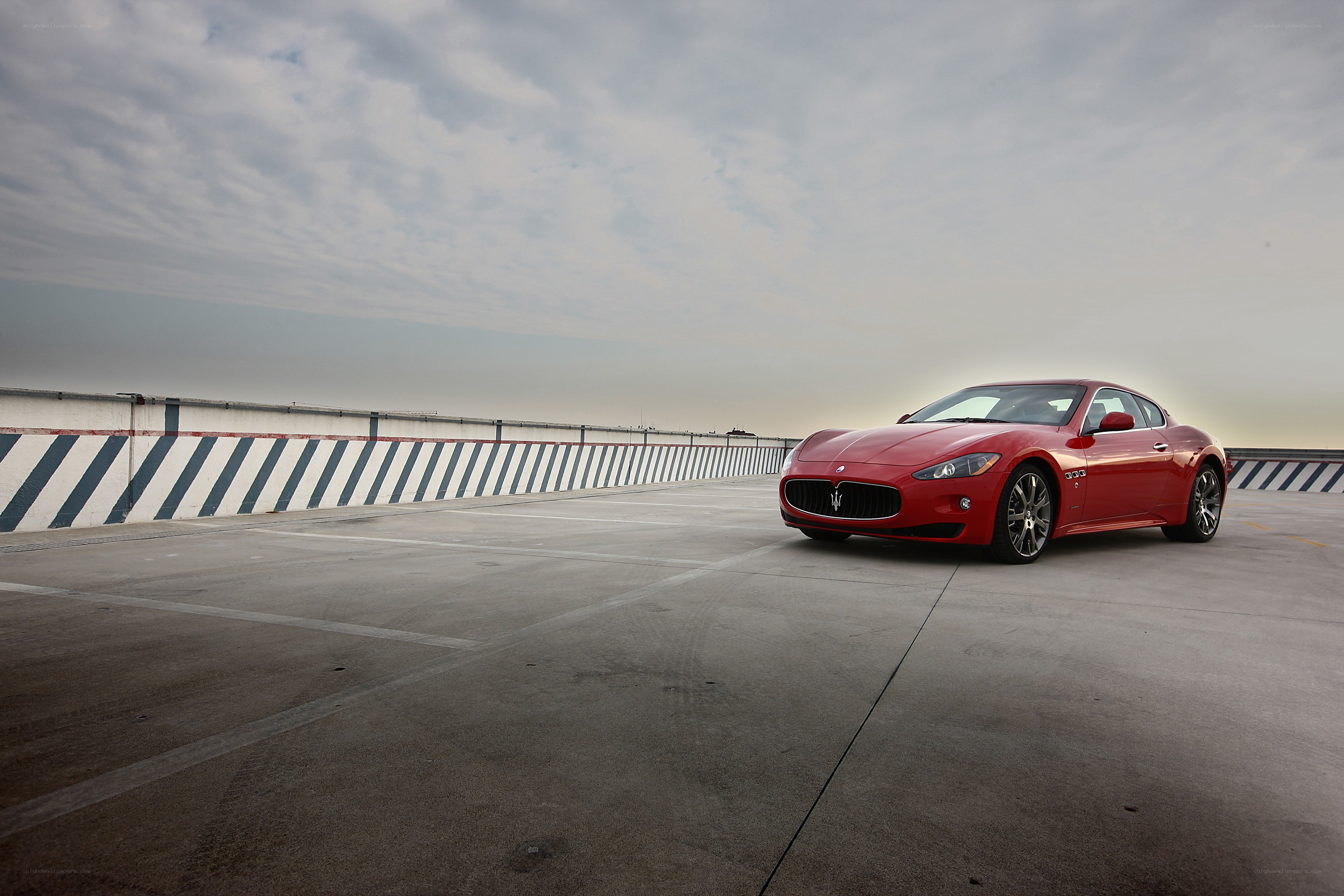 Red Maserati on rooftop