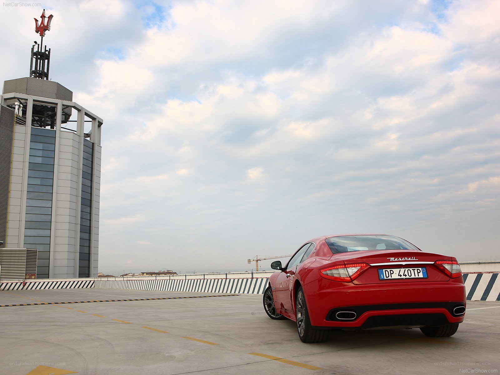 Red Maserati on rooftop