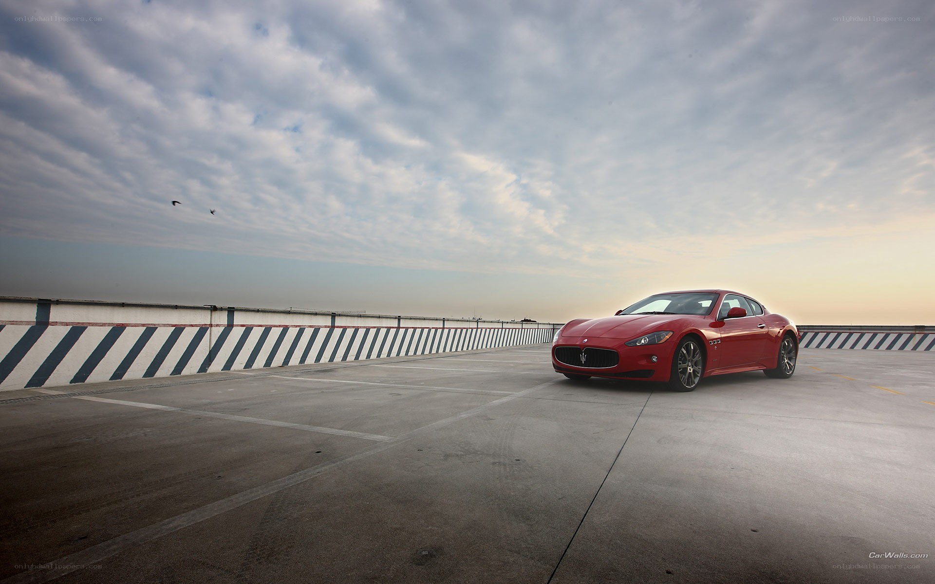 Red Maserati on rooftop