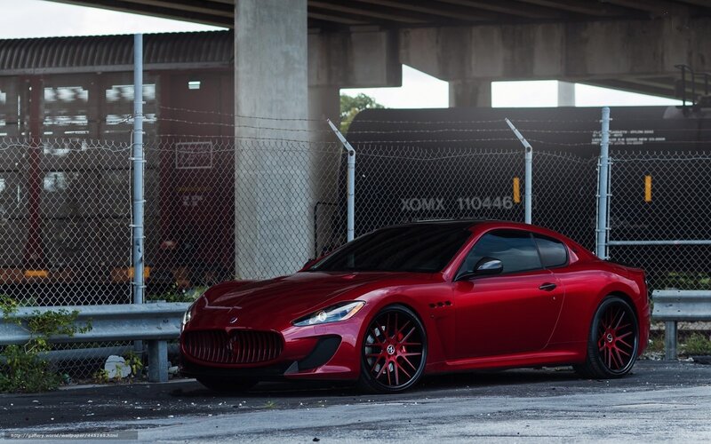 Red Maserati under overpass