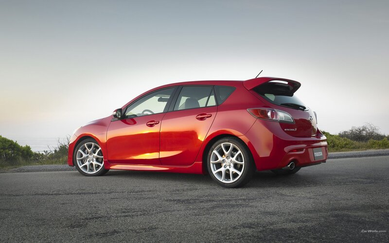 red mazda 3 hatchback