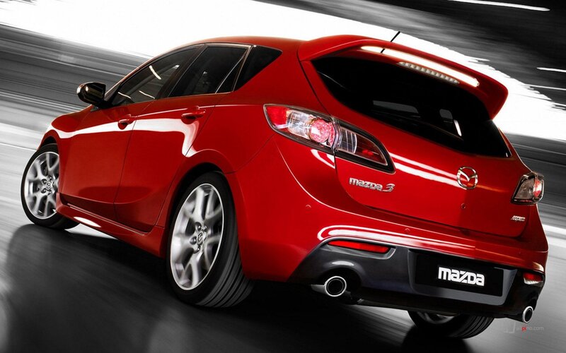 red mazda 3 hatchback