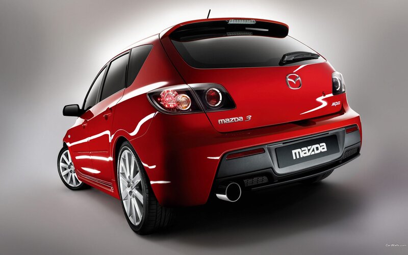 red mazda 3 hatchback