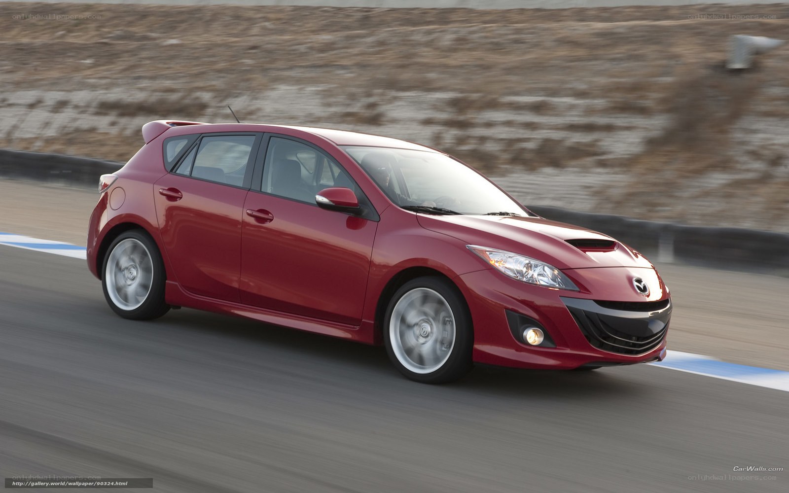 Red Mazda 3 on a racetrack