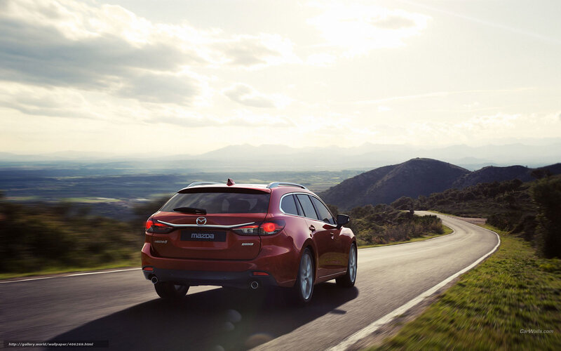 Red Mazda 6 Wagon on a winding road