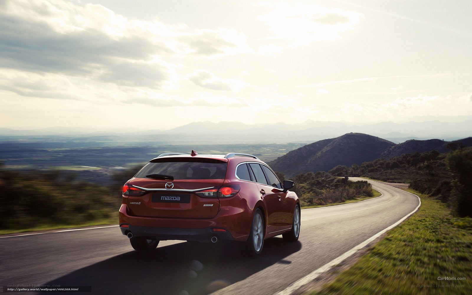 Red Mazda 6 Wagon on a winding road