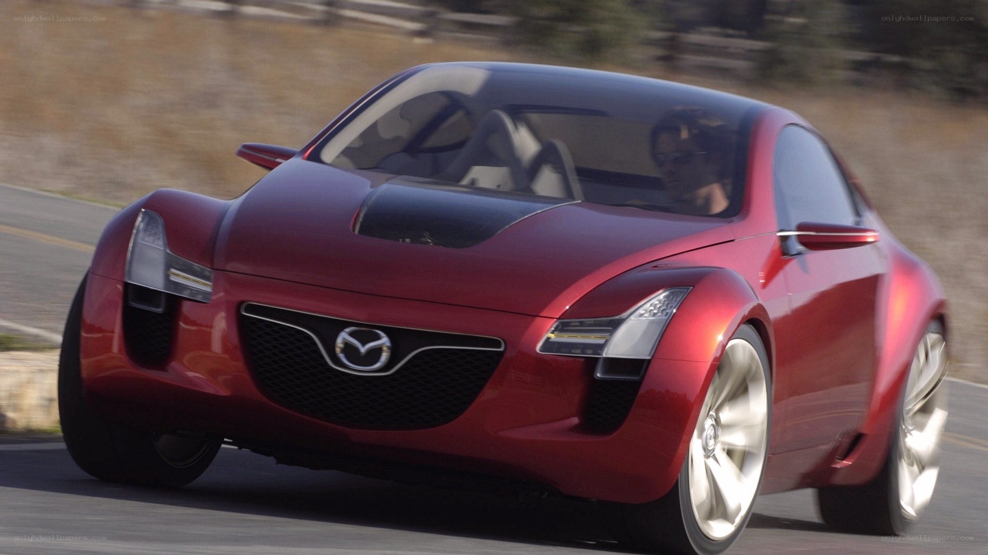 Red Mazda concept car in motion