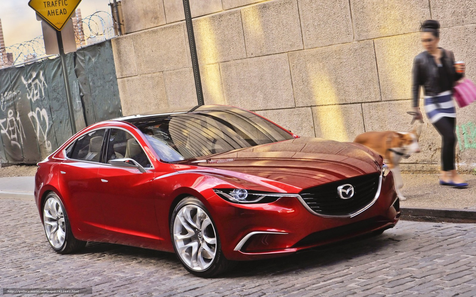 Red Mazda concept car on cobblestone street