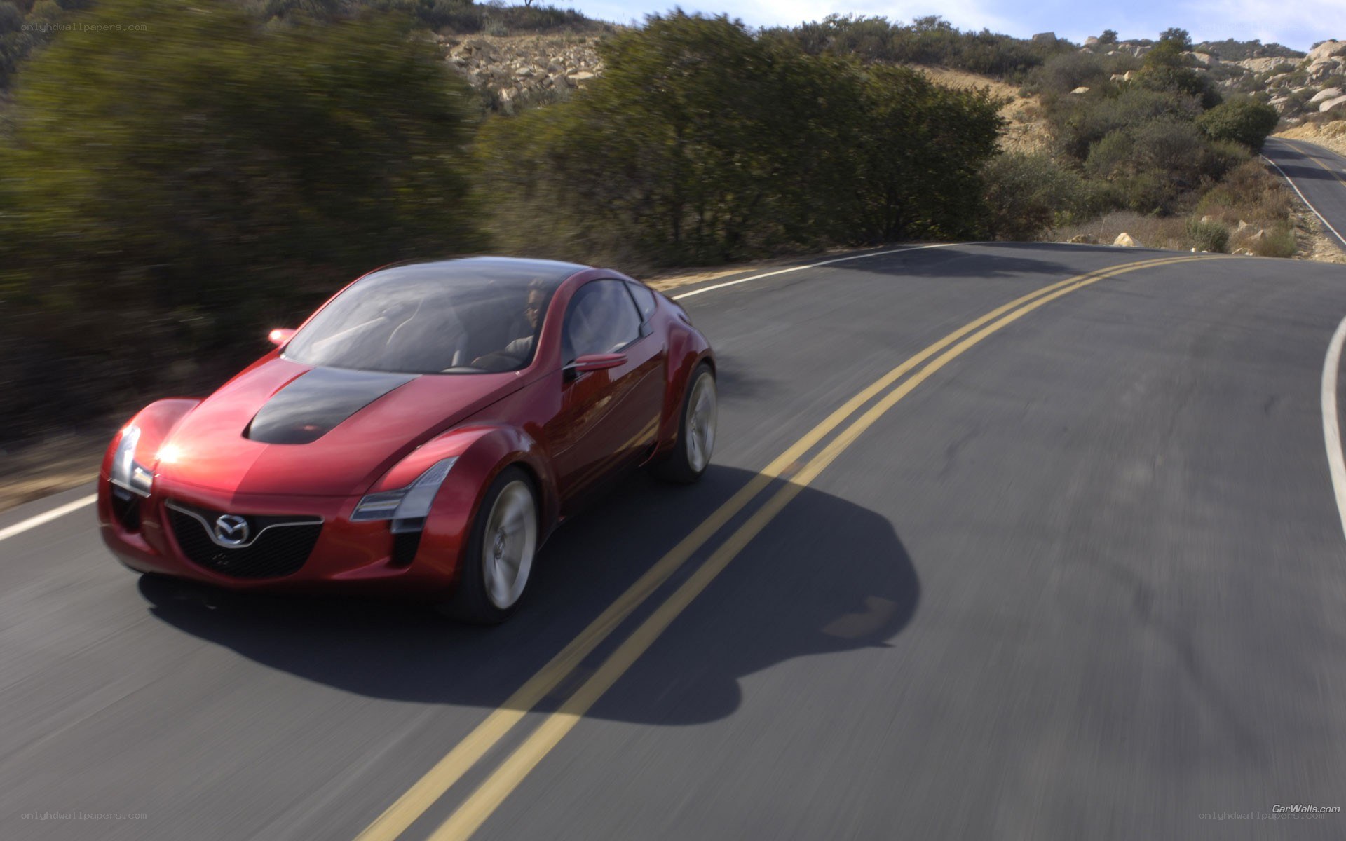 Red Mazda concept car on road
