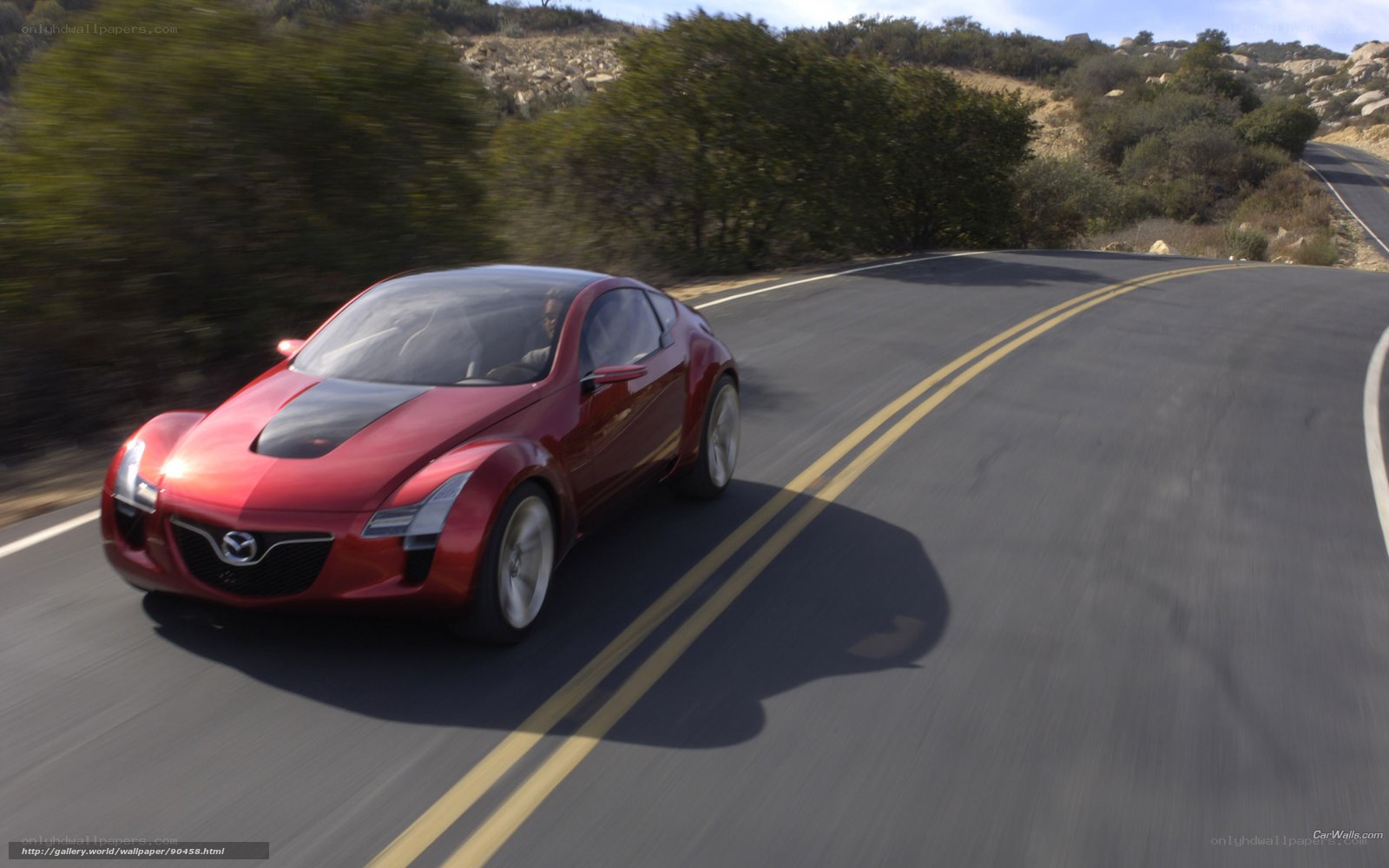 Red Mazda concept car on road