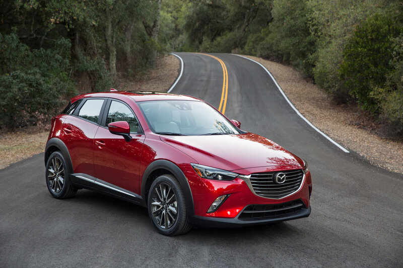 Red Mazda CX-3 on a winding road