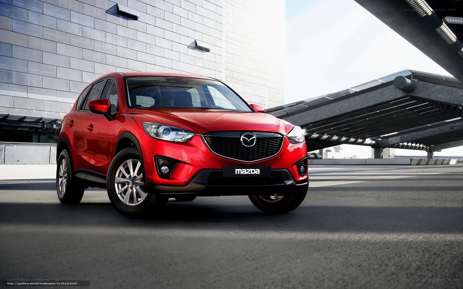 Red Mazda CX-5 in urban setting