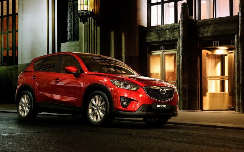 Red Mazda CX-5 on city street