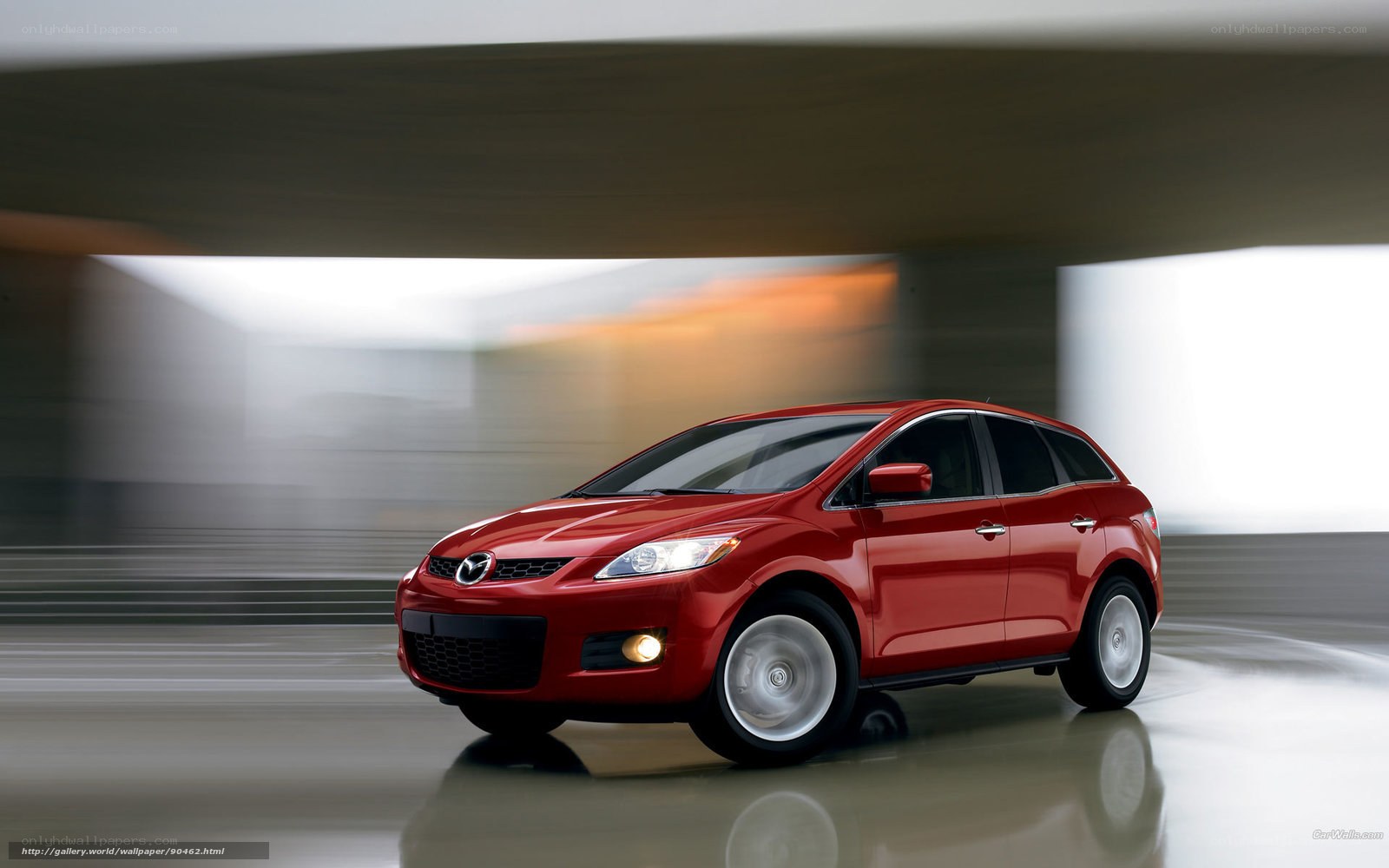 Red Mazda CX-7 in motion
