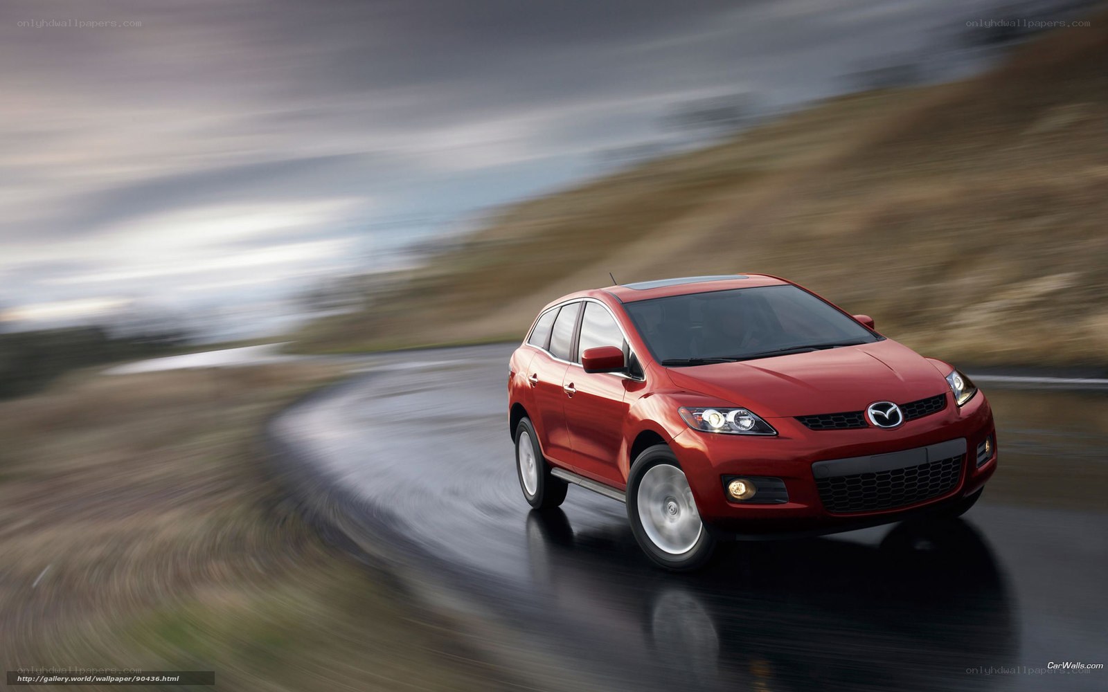 Red Mazda CX-7 on wet road