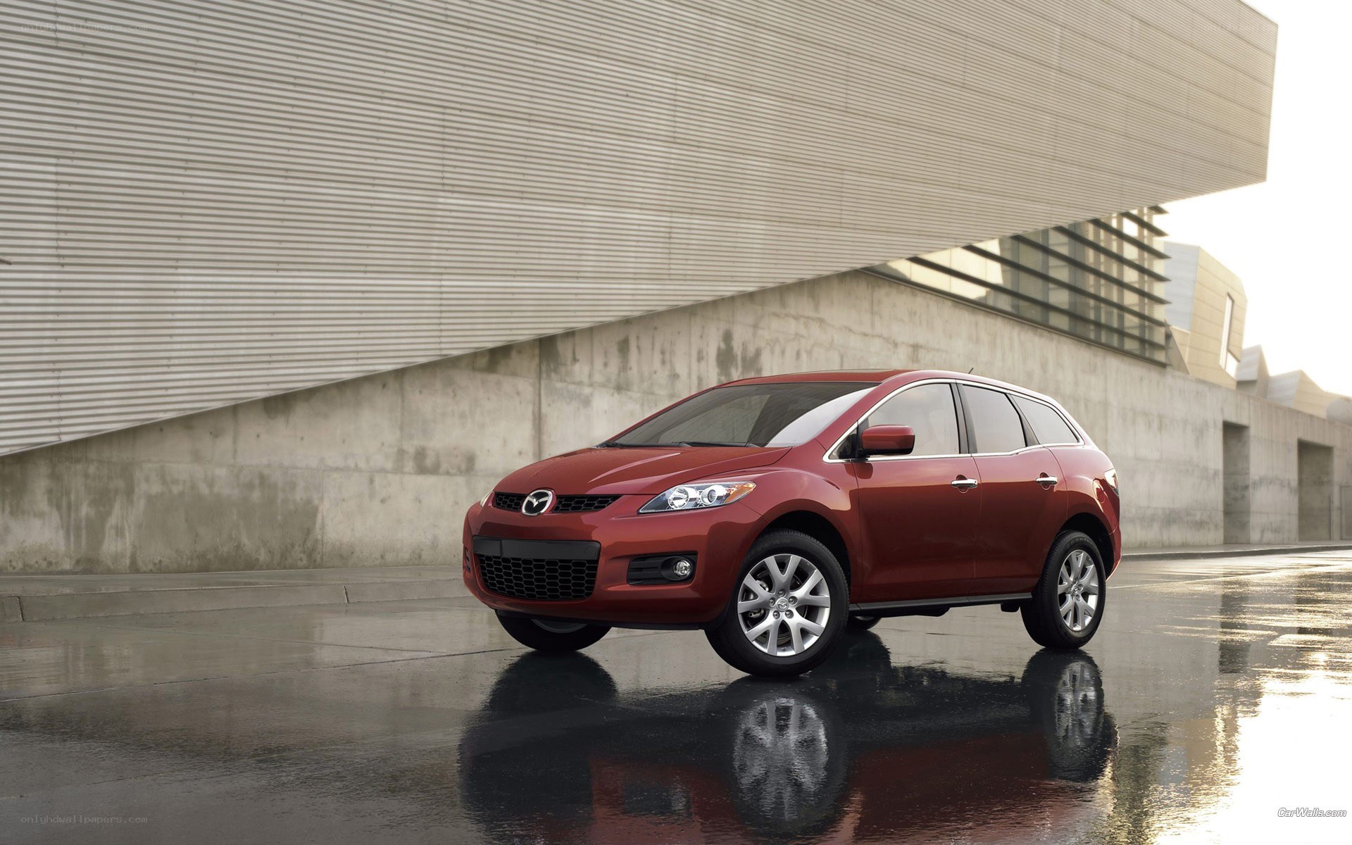 Red Mazda CX-7 parked outside