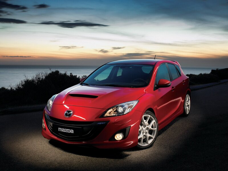 Red Mazda Hatchback — Dramatic
