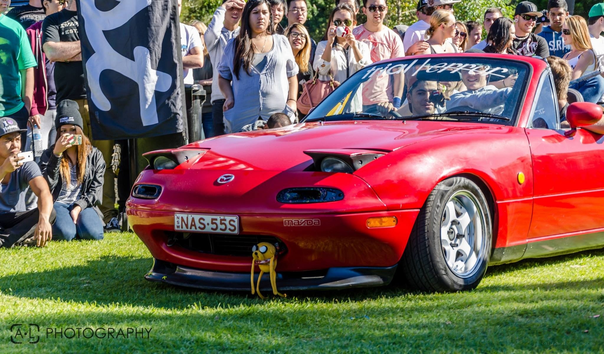 Red Mazda Miata at car show