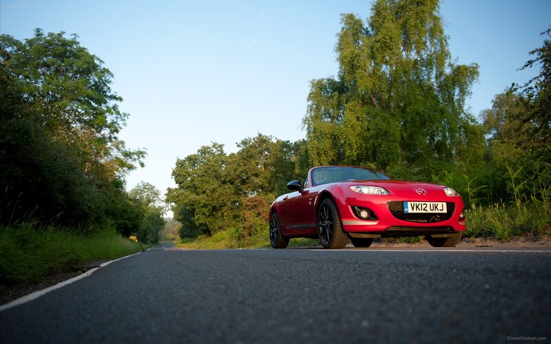 Red Mazda MX-5 on a country road