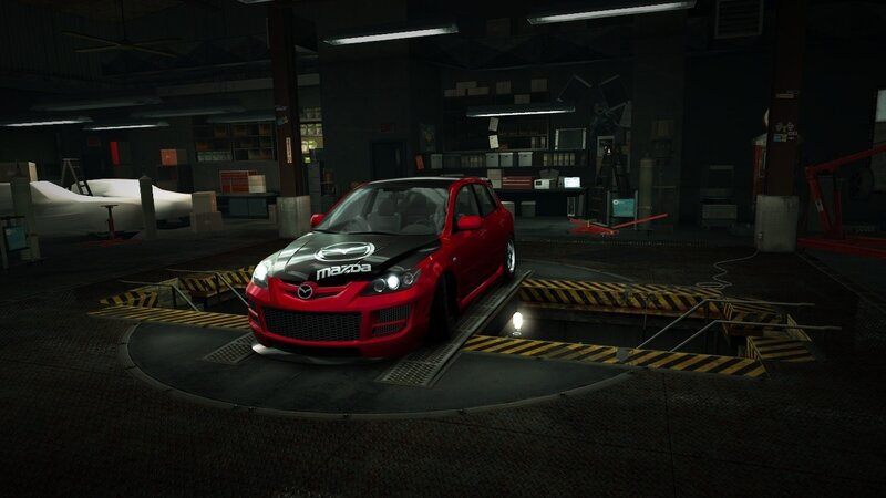 Red Mazda on a turntable