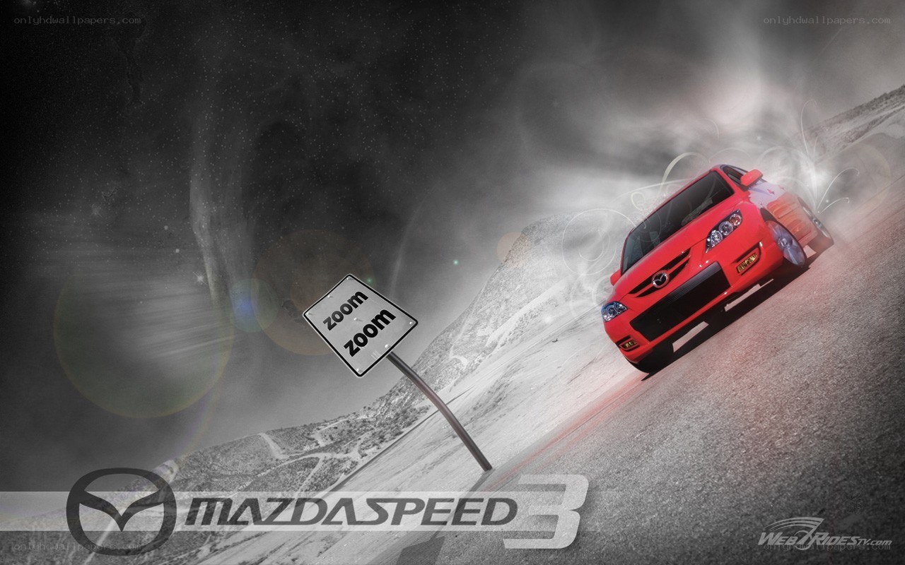 Red Mazda on a winding road