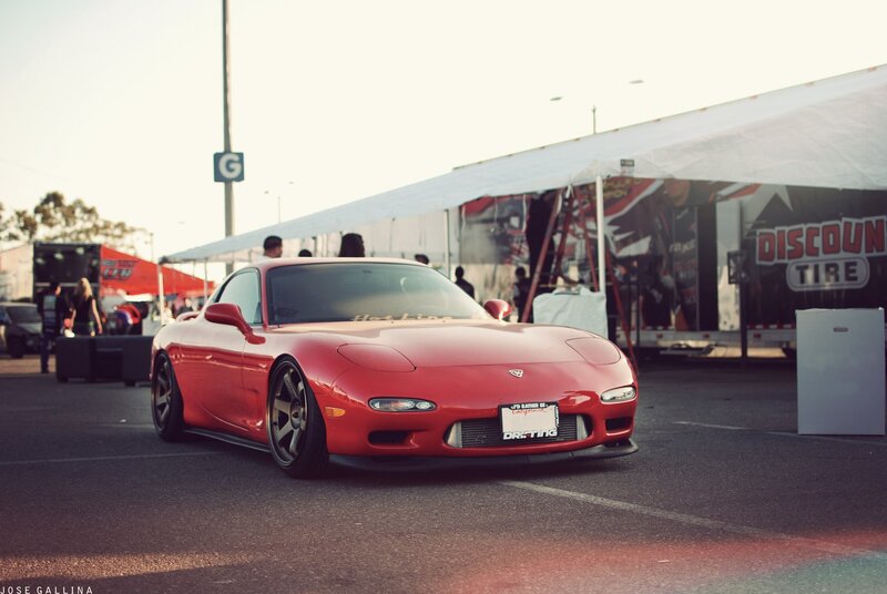 Red Mazda RX-7 at a car show