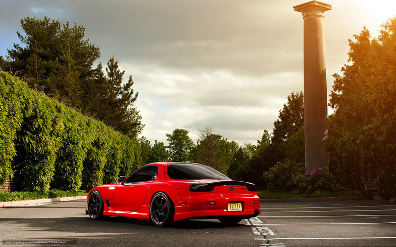 Red Mazda RX-7 in parking lot