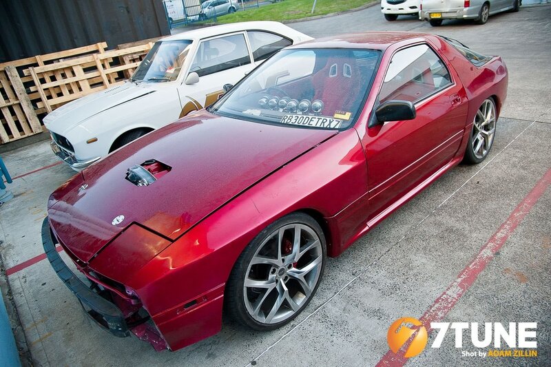Red Mazda RX-7 with custom modifications