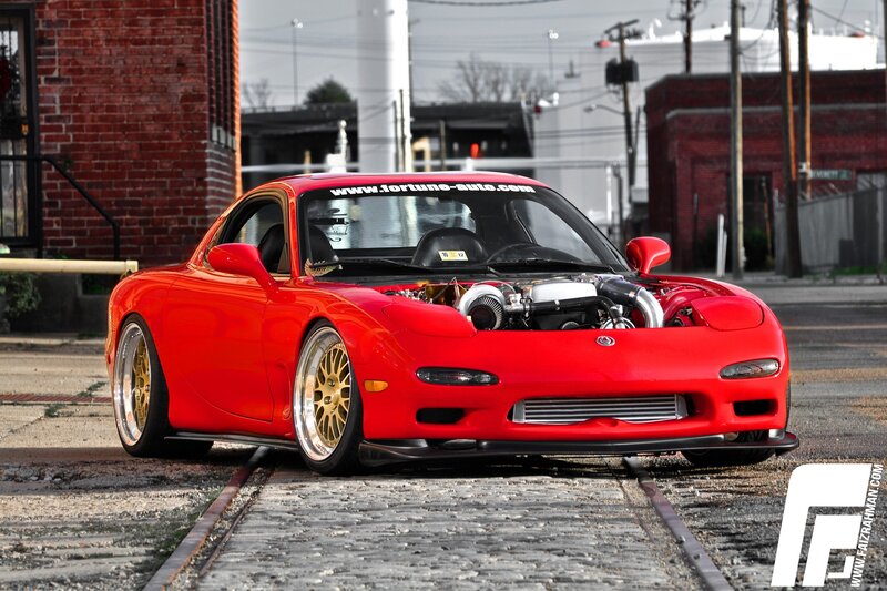 red mazda rx-7 with open hood