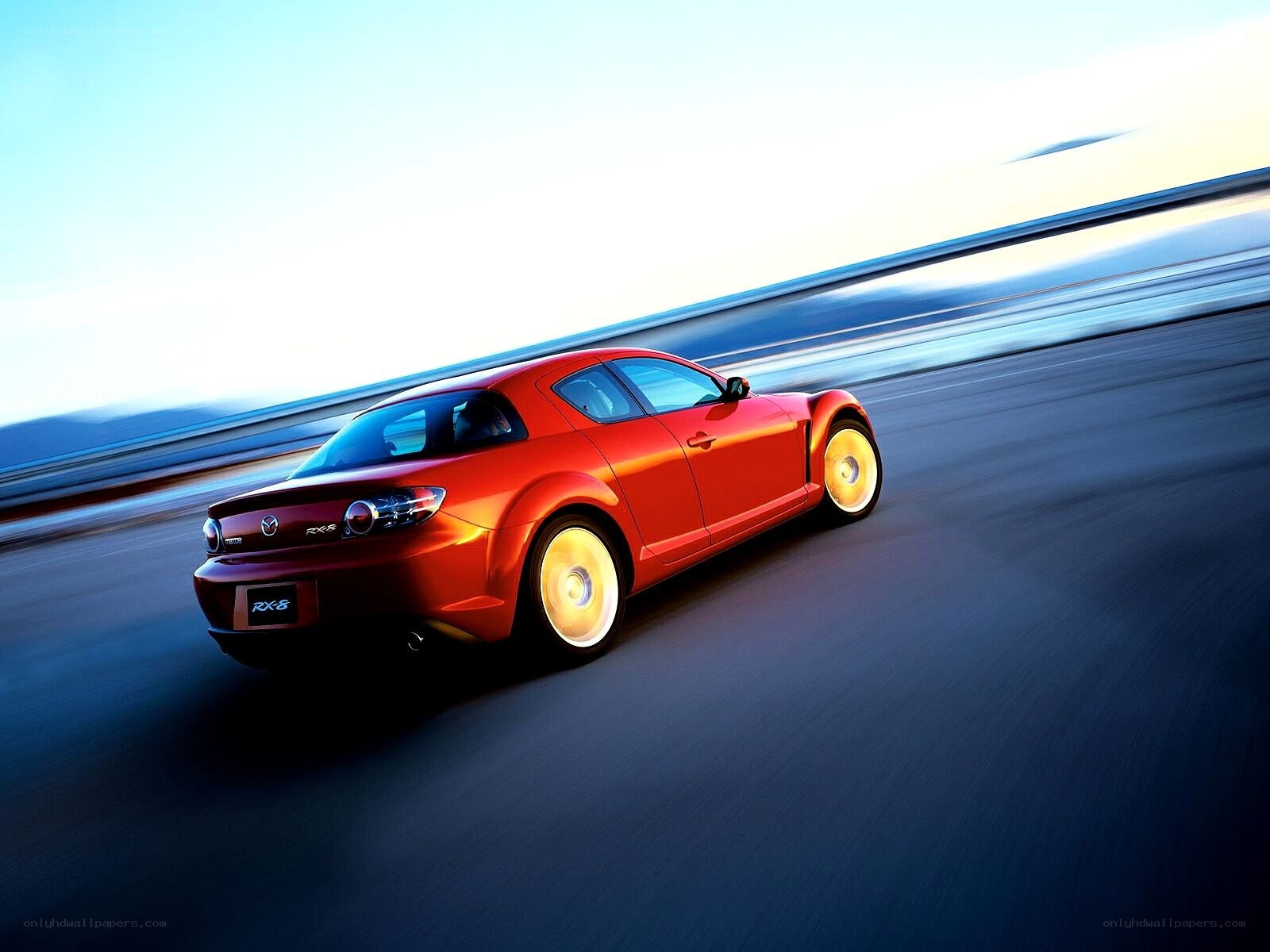 Red Mazda RX-8 in motion