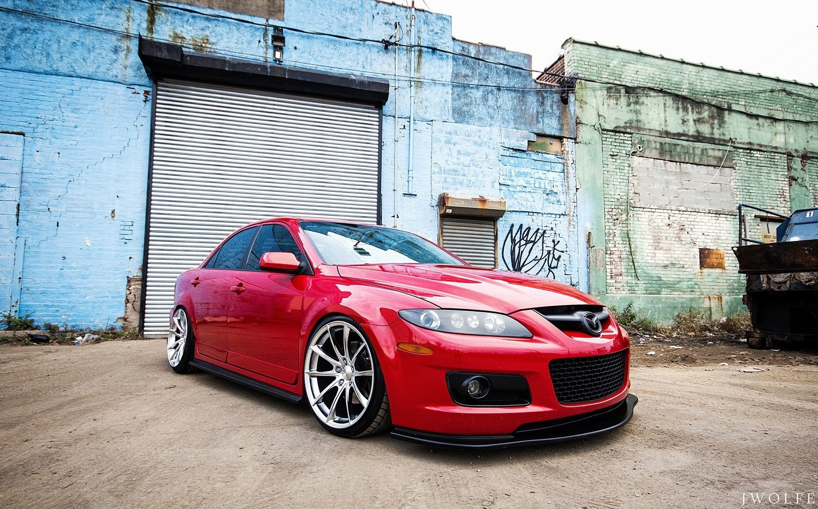 Red Mazda RX-8 in urban setting