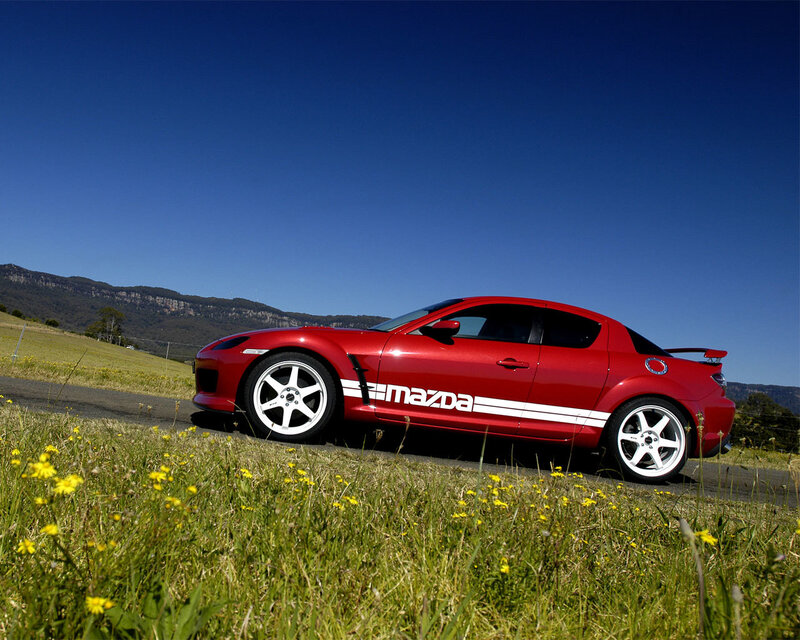 Red Mazda RX-8 on a country road