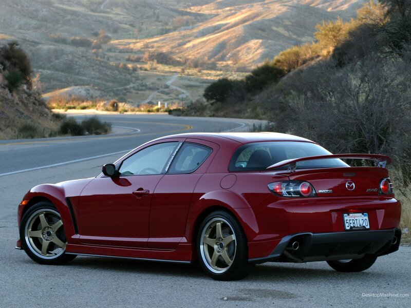 Red Mazda RX-8 on a winding road