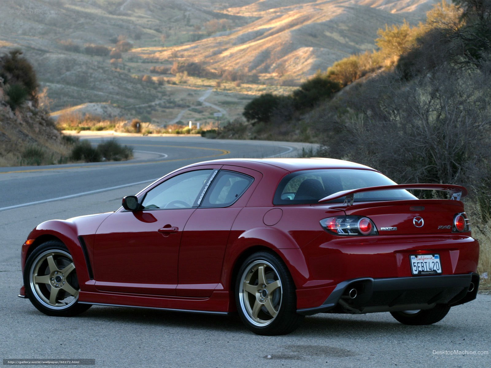 Red Mazda RX-8 on a winding road