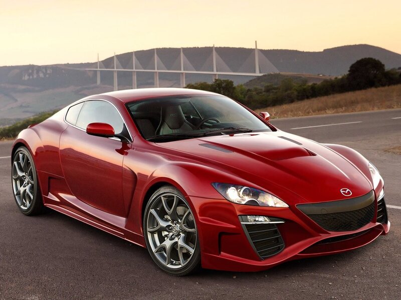 Red Mazda sports car on road