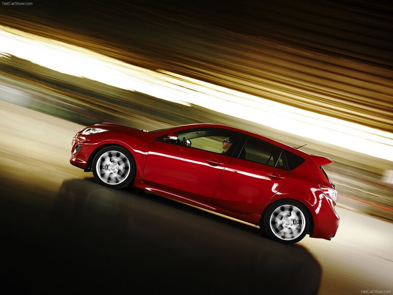 Red Mazda3 in motion