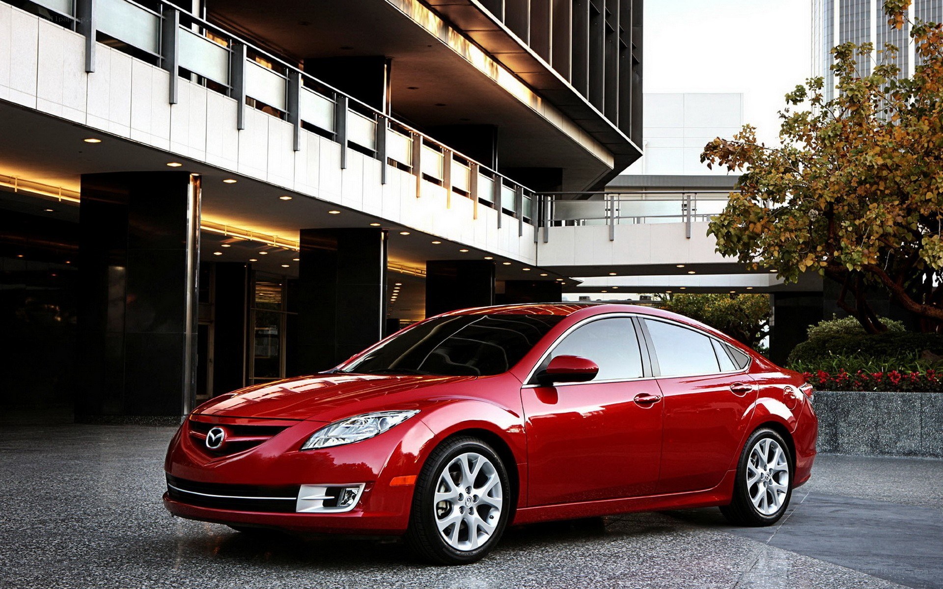 Red Mazda6 sedan in city