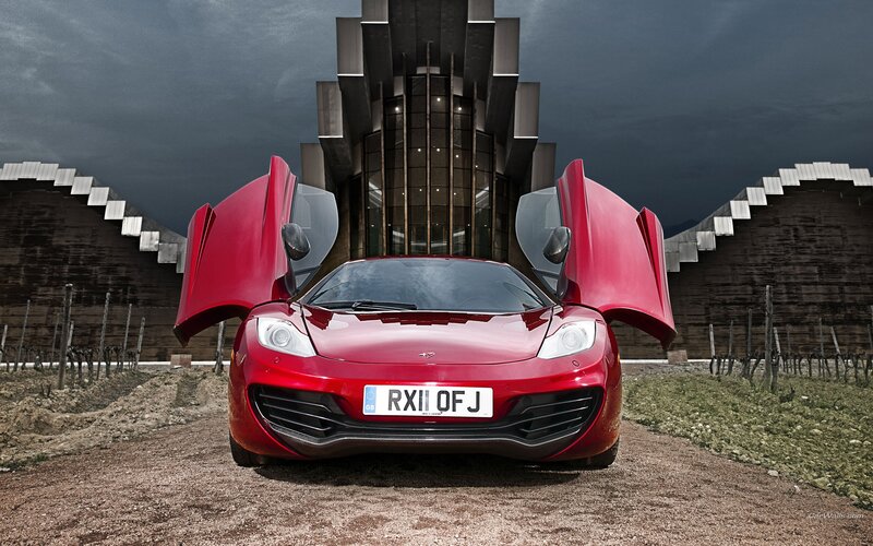 Red McLaren in a vineyard