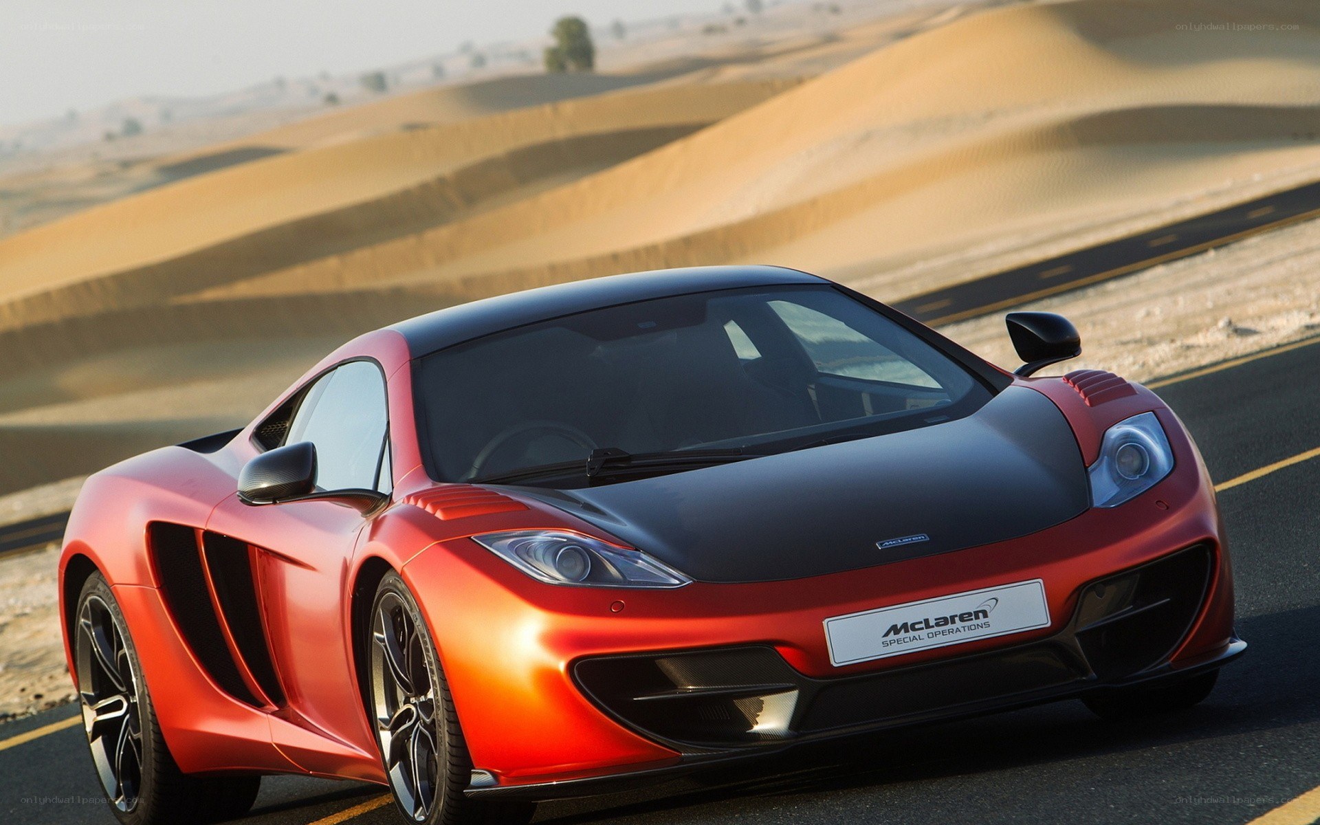 Red McLaren in desert
